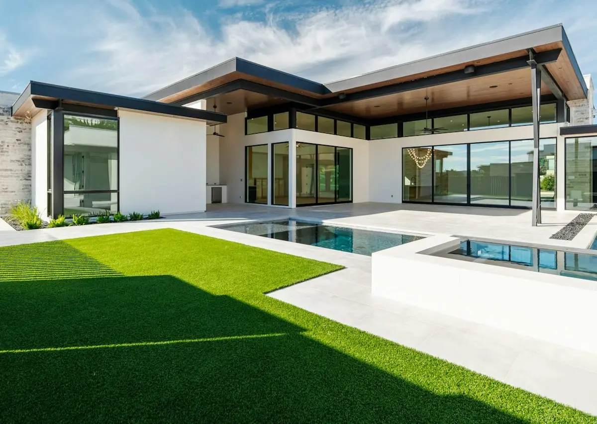 After: modern backyard with pool, patio and turf